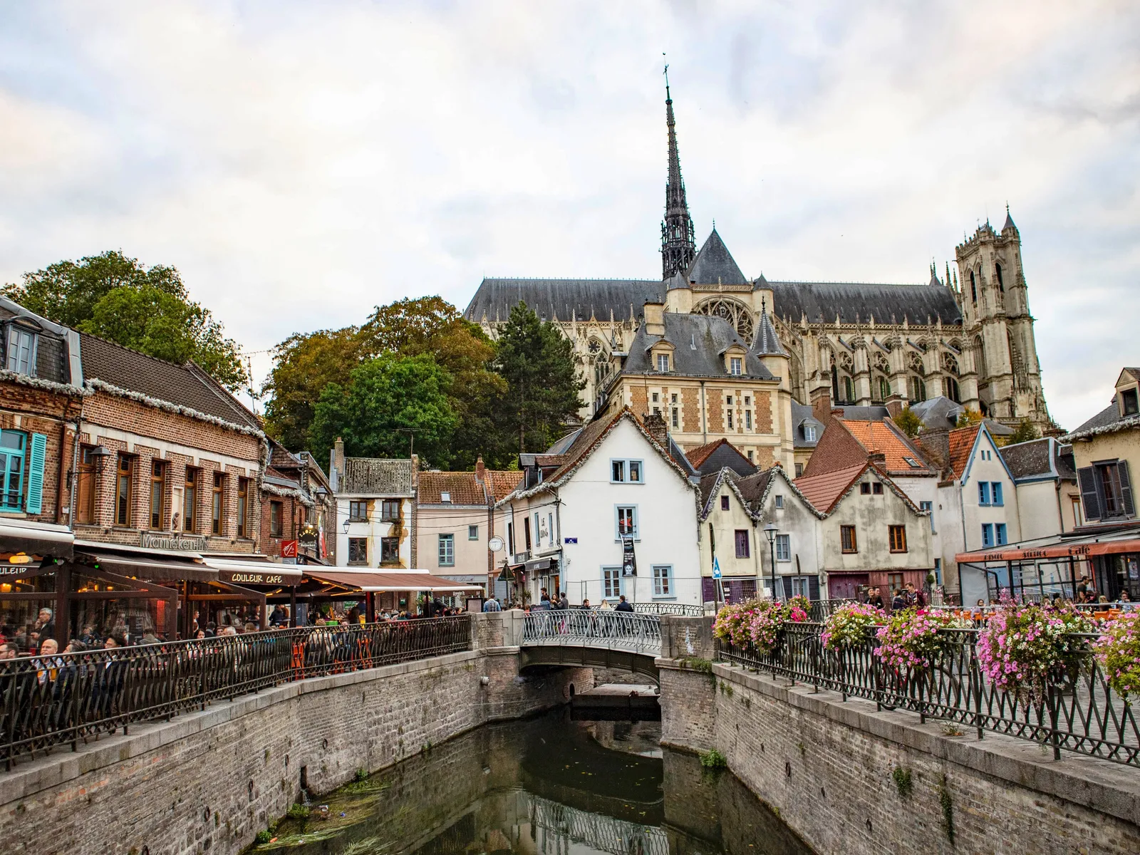 Amiens Cathedral and its spire rising above the Somme canal and the half-timbered houses of Saint-Leu