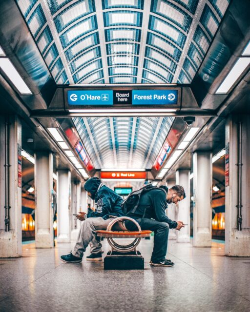 Passengers waiting in a modern railway station