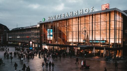 Cologne Hauptbahnhof main train station entrance with travellers in the evening