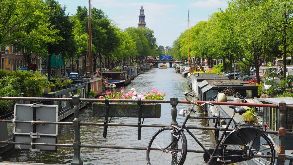 Amsterdam canal with bicycles and bridge