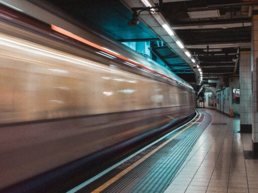 High-speed train passing through a station platform